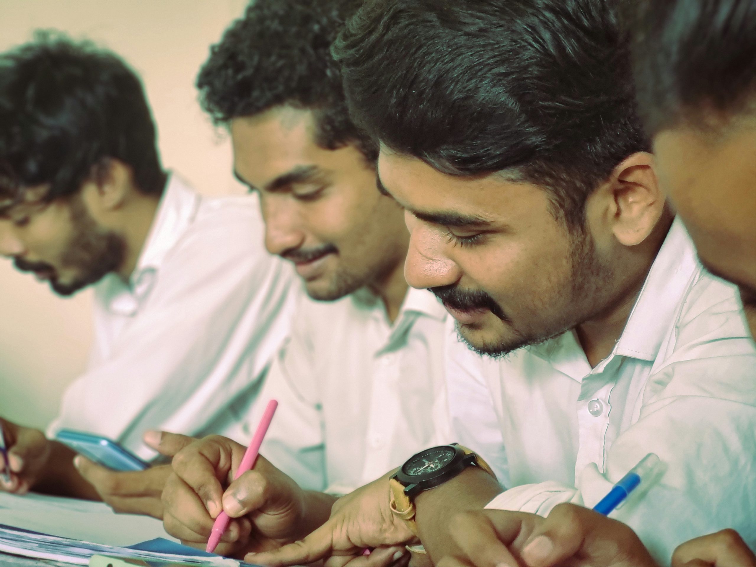 Engineering students in India taking notes during class