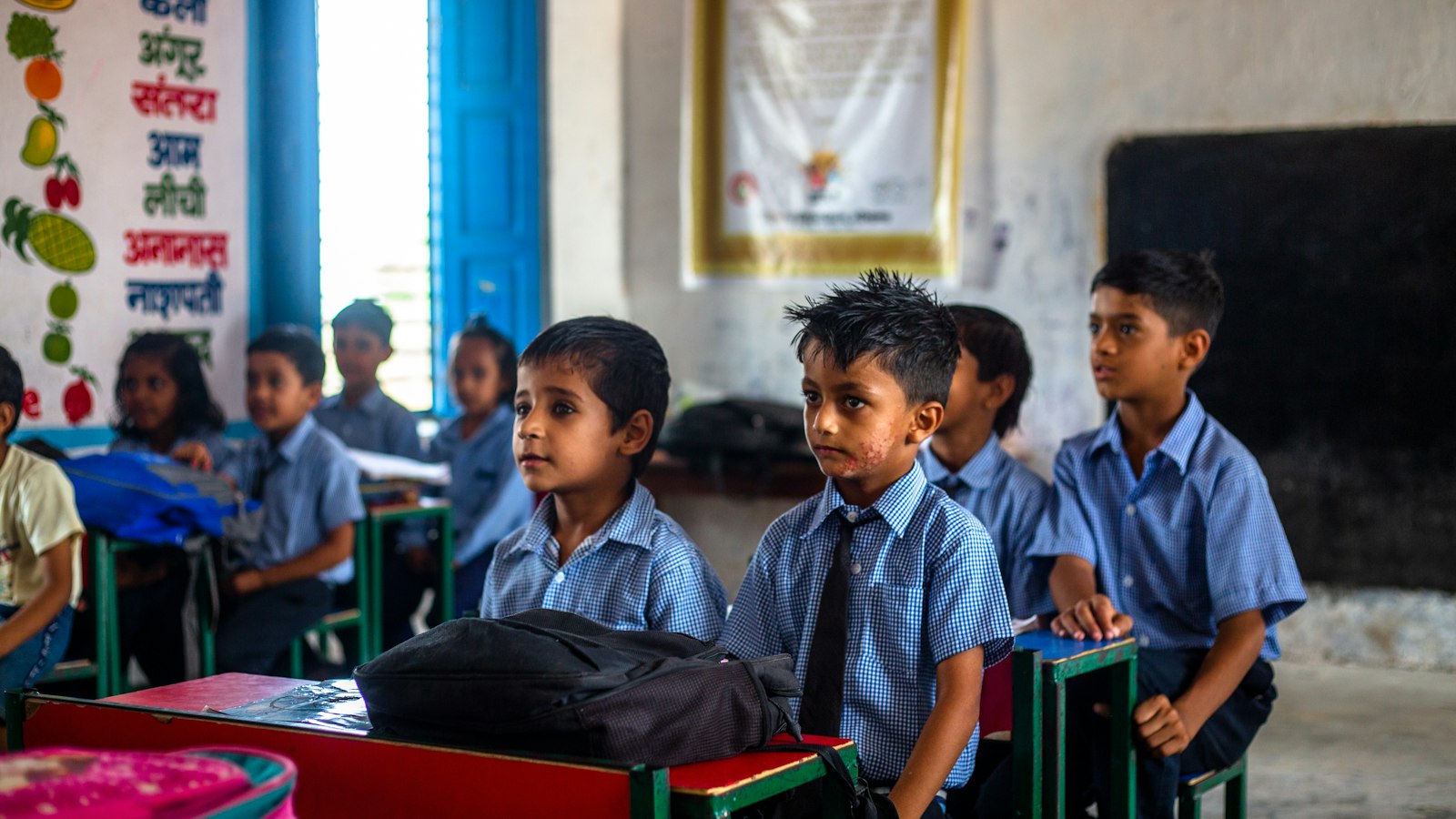 A group of young children sitting together in a classroom
